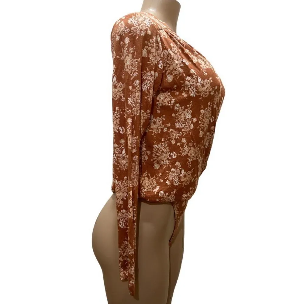 NWT-FREE PEOPLE Turnt Bodysuit
